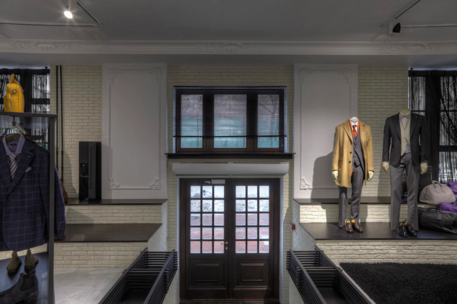suits on mannequins near doorway of clothing store 2026 01 09 08 42 18 utc 1536x1024